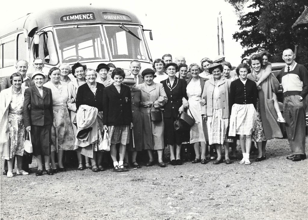 Congregational Church Choir standing in front of a coach