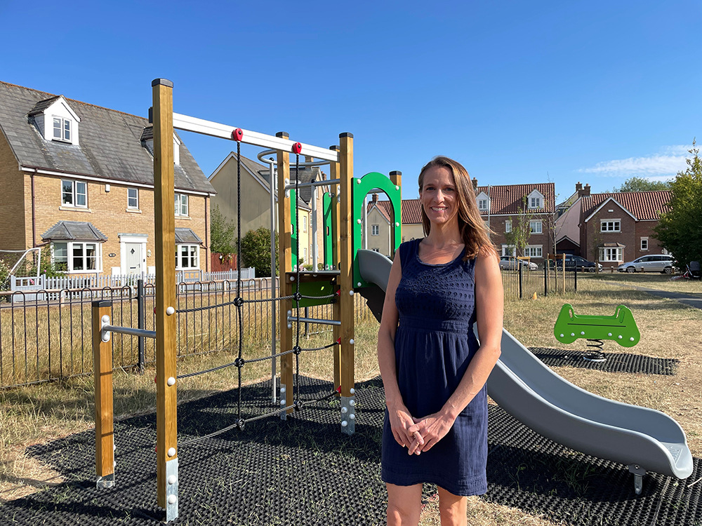 Woman standing by a playground slide