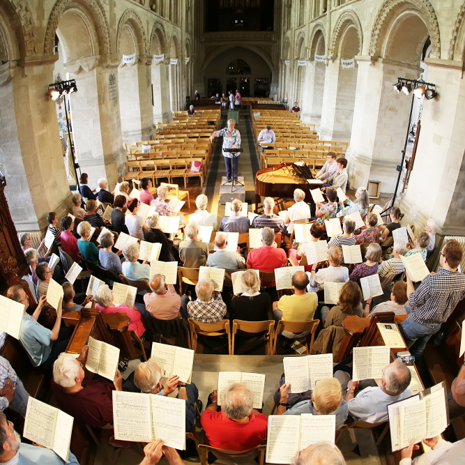photo of choral society rehearsing in abbey